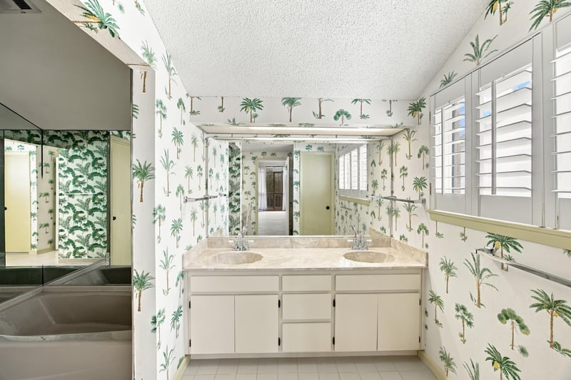 Bathroom dual vanity with palm wallpaper at 752 Spinnakers Reach Dr, Ponte Vedra Beach, FL 32082