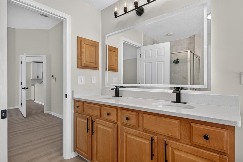 Bathroom vanity with hallway view at 224 Pine Arbor Cir, St. Augustine, FL 32084