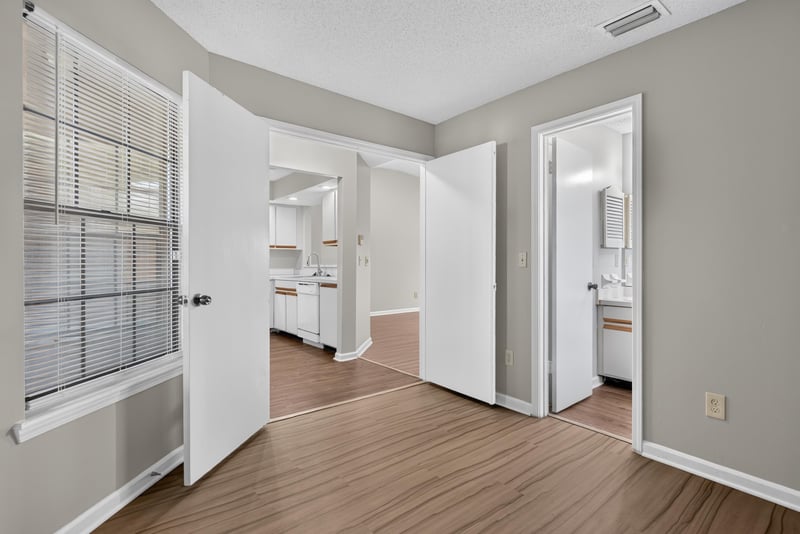 Hallway with doors to bathroom and bedroom at 8010 International Village Dr, Jacksonville, FL 32277