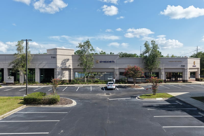Building front with SIP Resorts signage at 10550 Deerwood Park Blvd, Jacksonville, FL 32256
