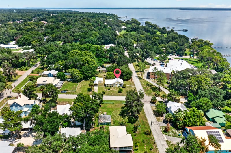 Drone view of lake and surrounding neighborhood in Crescent City, FL