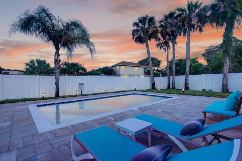Backyard pool at day-to-dusk at 1525 8th St N, Jacksonville Beach, FL