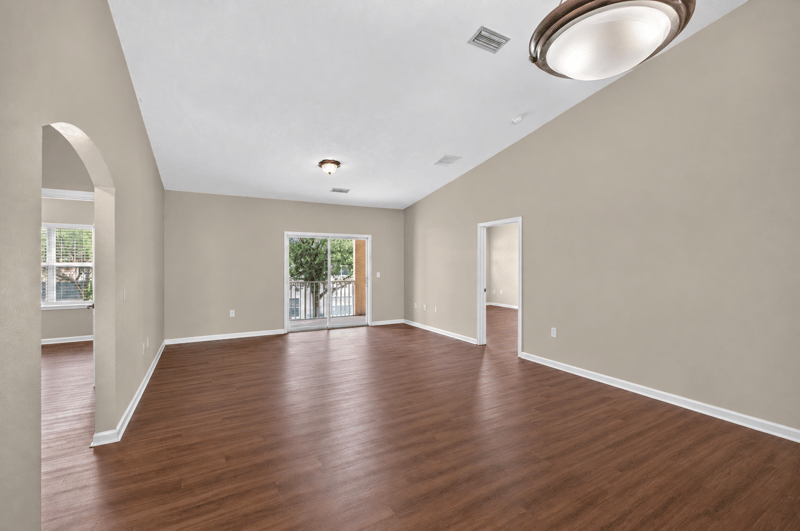 Open living space with arched entry and window at 3750 Silver Bluff Blvd, Orange Park, FL