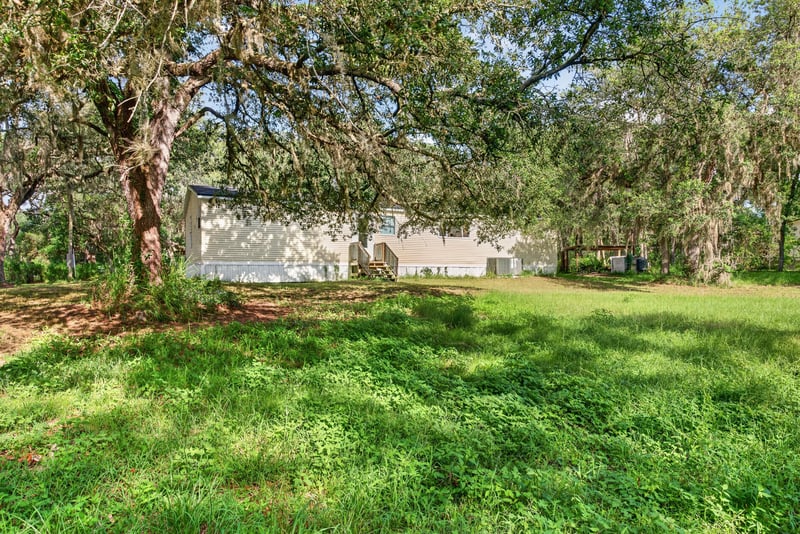 Side yard with neighboring home visible at 3215 Robin Ln, Middleburg, FL