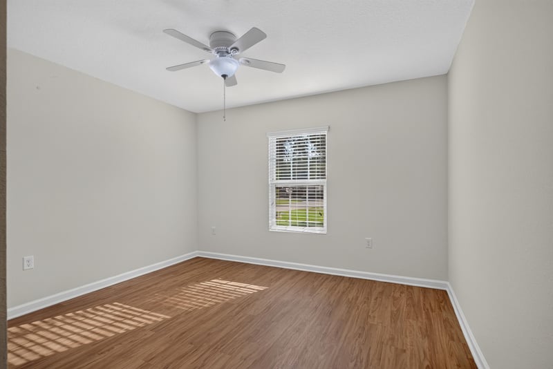 Bedroom with ceiling fan and window at 95221 Siena Ct, Fernandina Beach, FL 32034