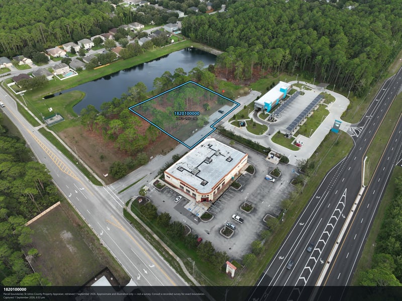 Aerial view of the pond, parking lot, and building at 4900 US-1, St. Augustine, FL 32086