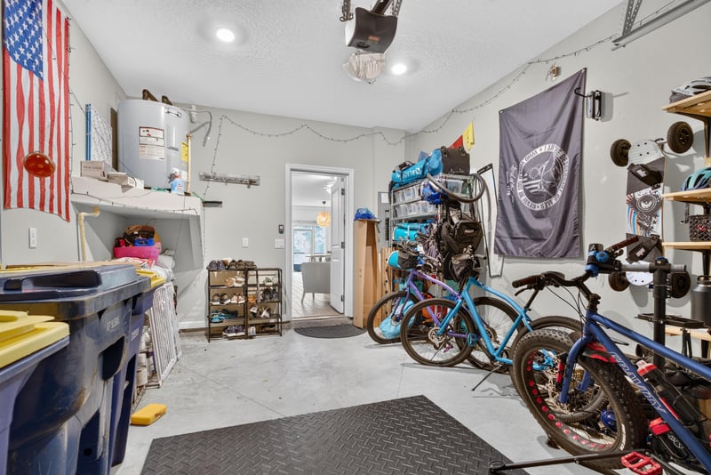 Garage interior with flags and shelving at 1186 Beach Dune Dr, Jacksonville, FL 32233
