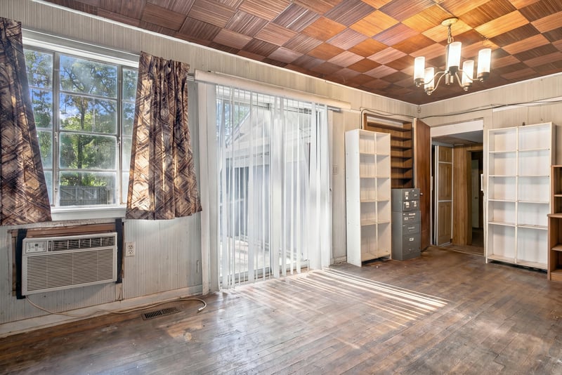 Room with parquet checkerboard ceiling and sliding glass doors at 1807 Idlewild Ave, Green Cove Springs, FL