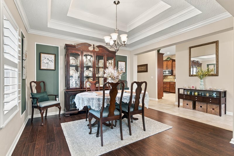 Dining room with table, chairs and chandelier at 10923 Black Diamond Ct, Jacksonville, FL