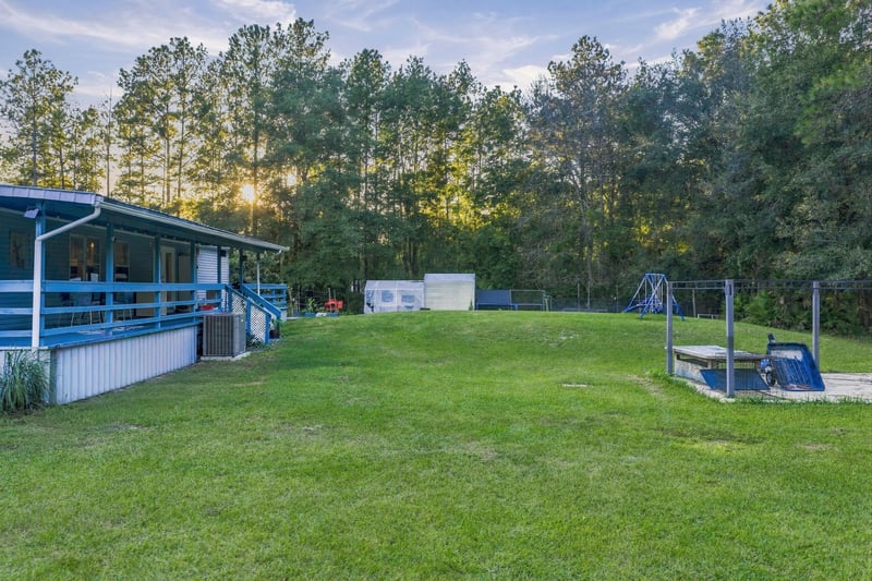 Porch view at day-to-dusk, photographed by Megapixeler on Secret Cove Rd, Middleburg, FL