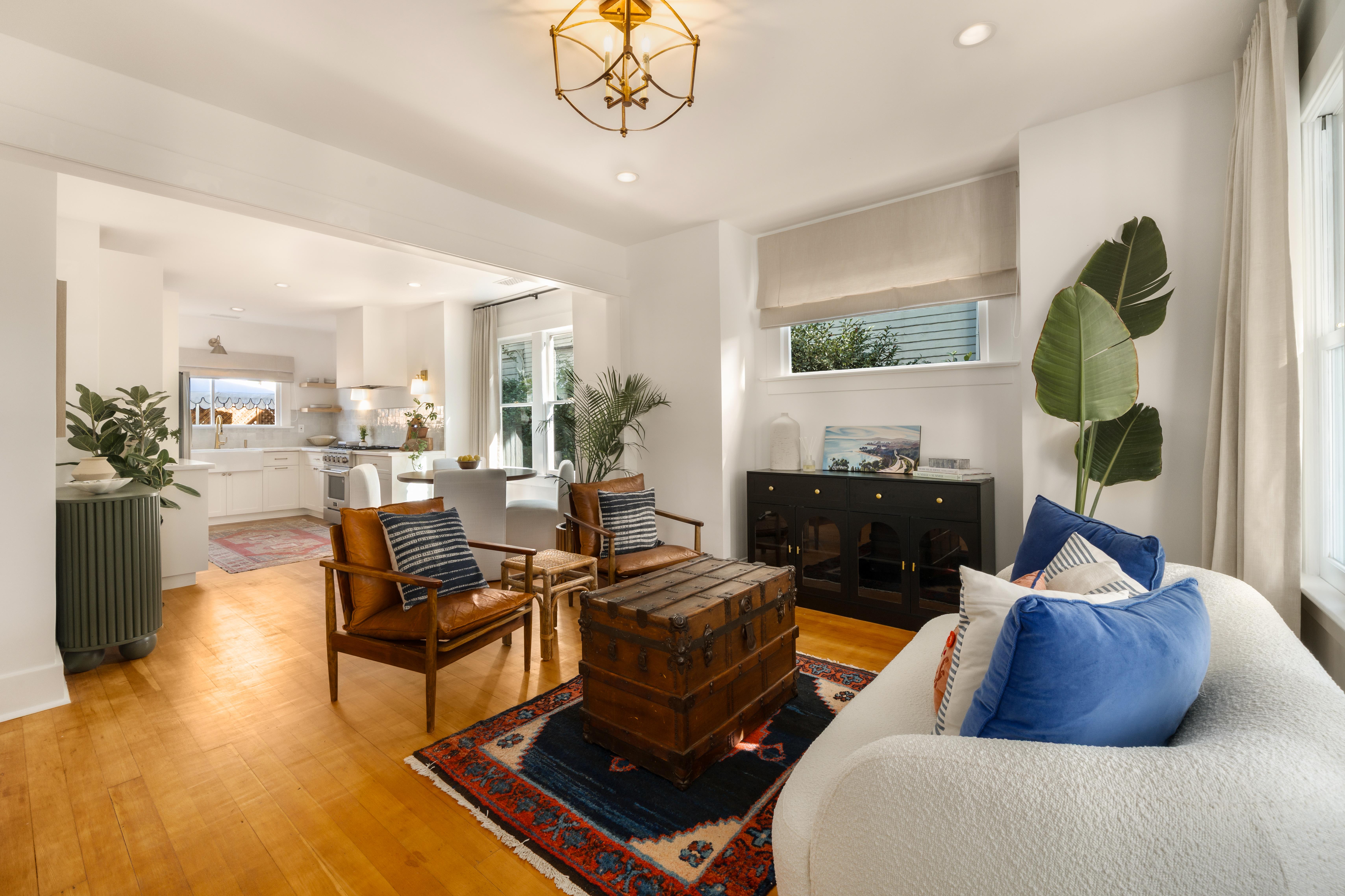 Real estate drone photography of 1508 De La Vina St, Santa Barbara — rooftop and streetscape perspective near the American Riviera