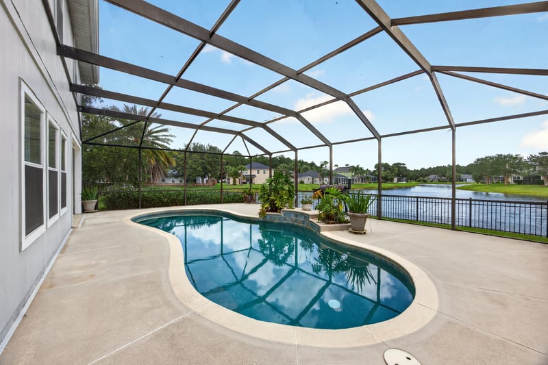 Screened pool with lake view at 1493 Greyfield Dr, St. Augustine, FL 32092