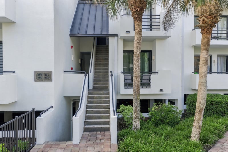 Building entrance stairway with palm trees at 805 Spinnakers Reach Dr, Ponte Vedra Beach, FL 32082