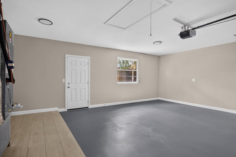 Garage interior with finished flooring at 4117 Wilcrest Ct, Jacksonville, FL 32277