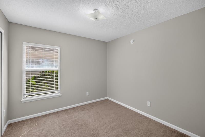 Carpeted bedroom with window at 14147 Fish Eagle Dr E, Jacksonville, FL 32226