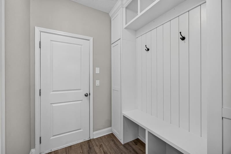 Mudroom with built-in bench and storage cubbies at 53 Lumen Ct, St. Augustine, FL 32095