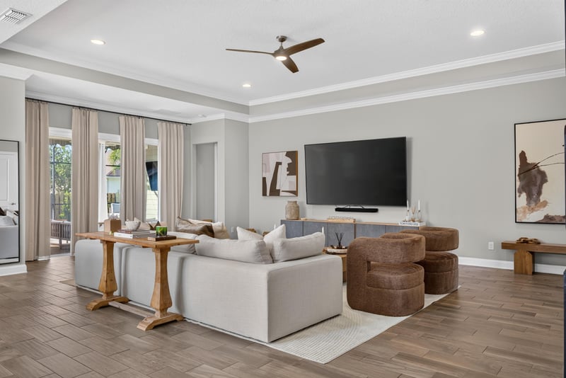Living room with sectional and sliding glass doors at 3328 Southern Oaks Dr, Green Cove Springs, FL 32043