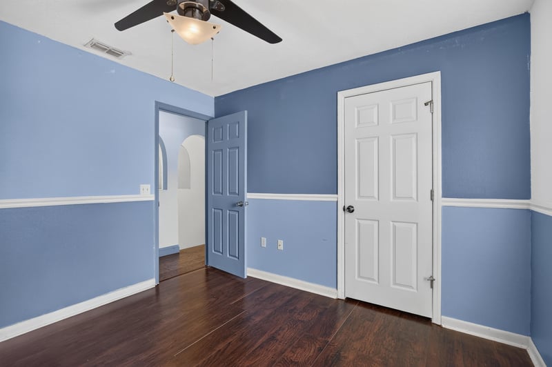 Bedroom with periwinkle walls and door at 3428 Glenn Hollow Ct, Jacksonville, FL 32226