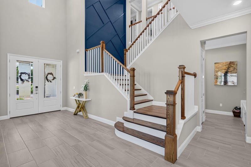 Staircase with wood treads and white railing at 22 Azura Point