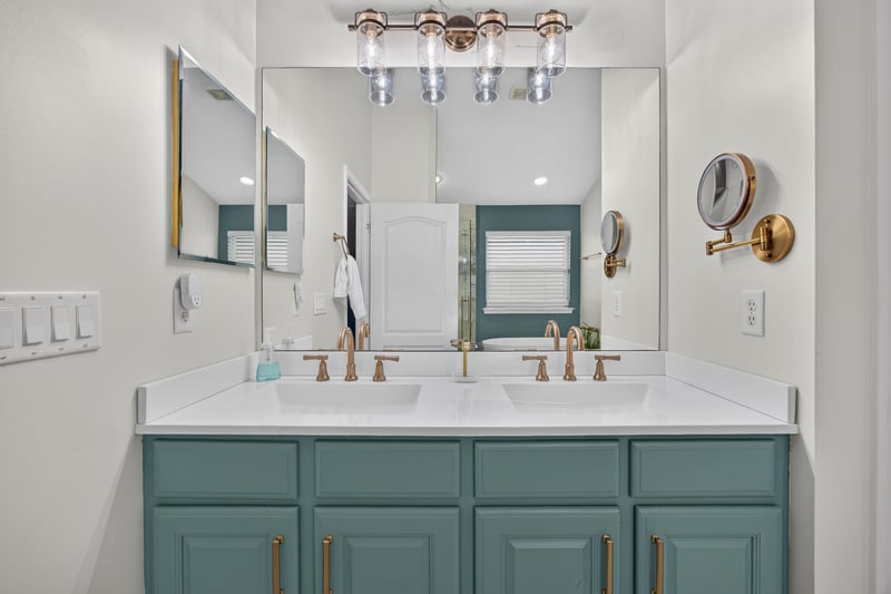 Primary bathroom vanity with gold fixtures at 3112 Silverado Cir, Green Cove Springs, FL 32043