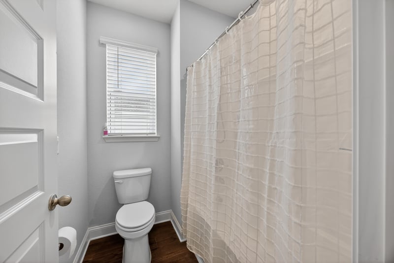 Bathroom with tub and shower curtain at 85491 Fall River Pkwy, Fernandina Beach, FL 32034