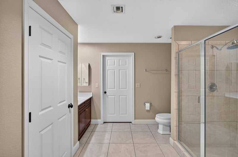 Bathroom with shower and double vanity doors at 1478 Riverplace Blvd 1904, Jacksonville, FL 32207