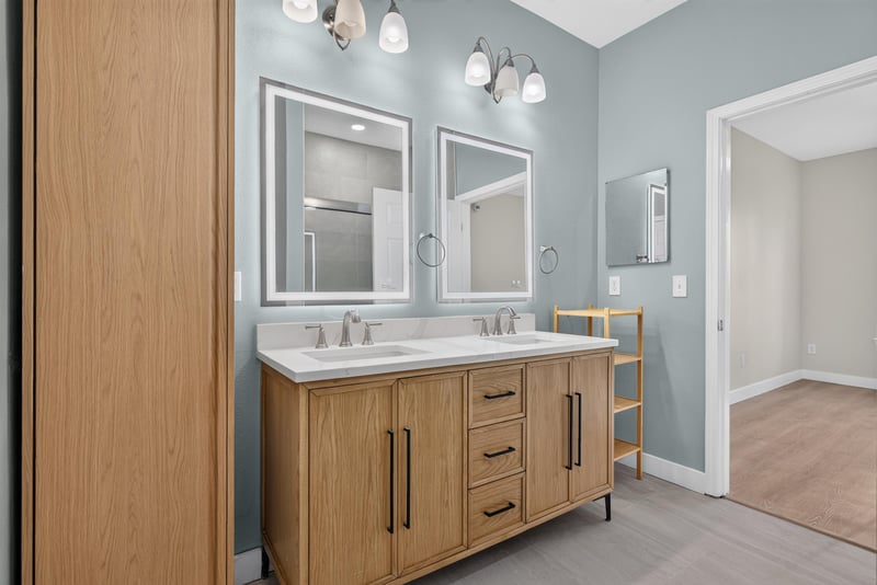 Primary bathroom double vanity and mirrors at 11251 Campfield Dr unit 1202, Jacksonville, FL 32256