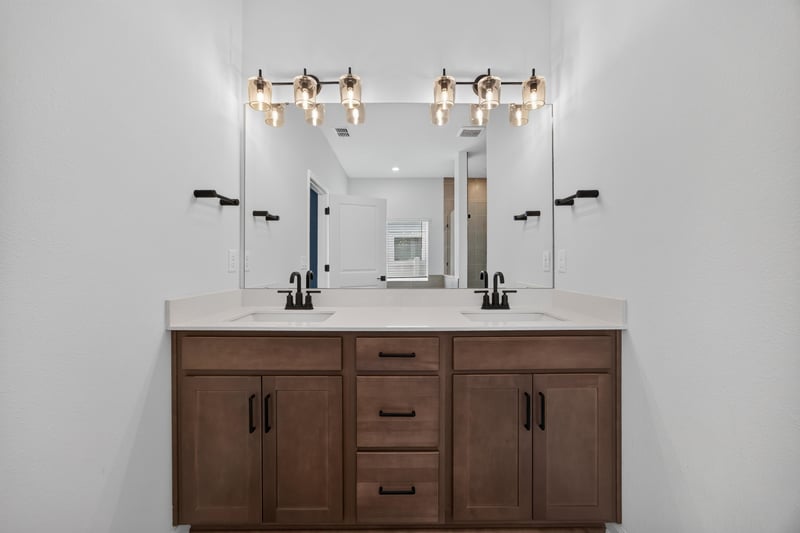 Primary bathroom vanity with mirror lighting at 2354 Jennings Farm Dr, Middleburg, FL 32068