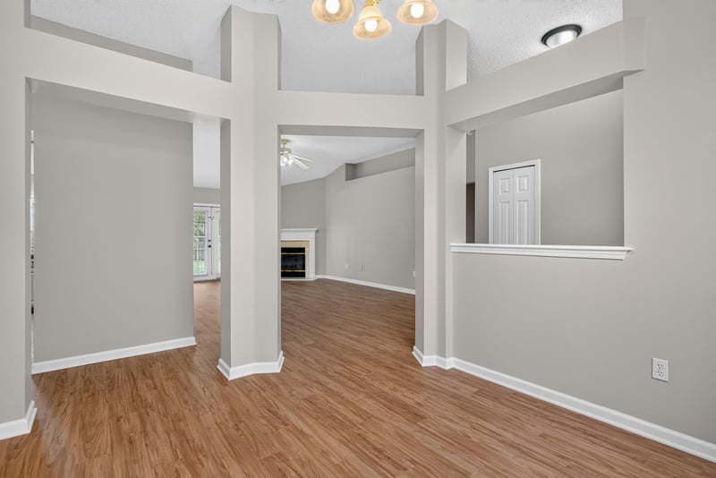 Living room with columns and wood floor at 12949 Chets Creek Dr S, Jacksonville, FL 32224