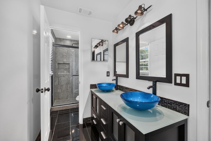 Bathroom with double blue vessel sinks at 3428 Glenn Hollow Ct, Jacksonville, FL 32226