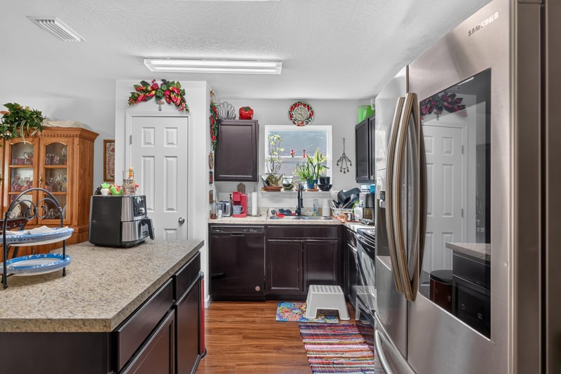 Kitchen counter and cabinetry with hardwood floor at 518 Matecumbe Ct, Macclenny, FL