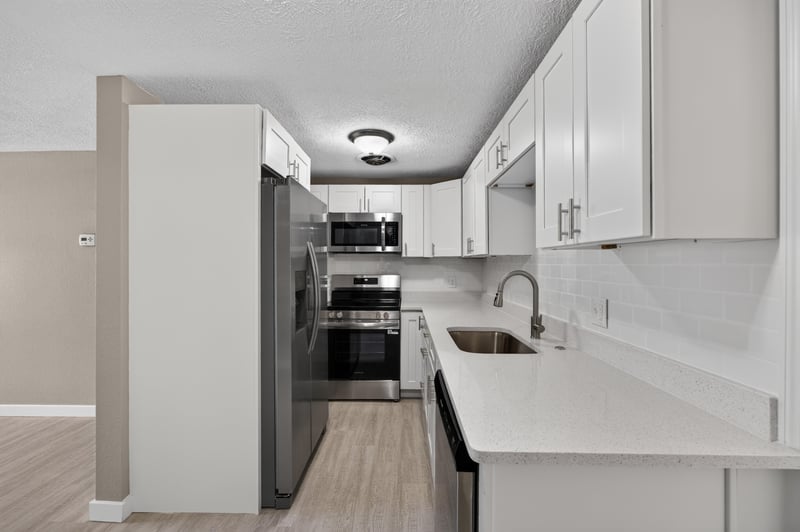 Kitchen with quartz counters and white cabinetry at 184 Draco St, Orange Park, FL 32073