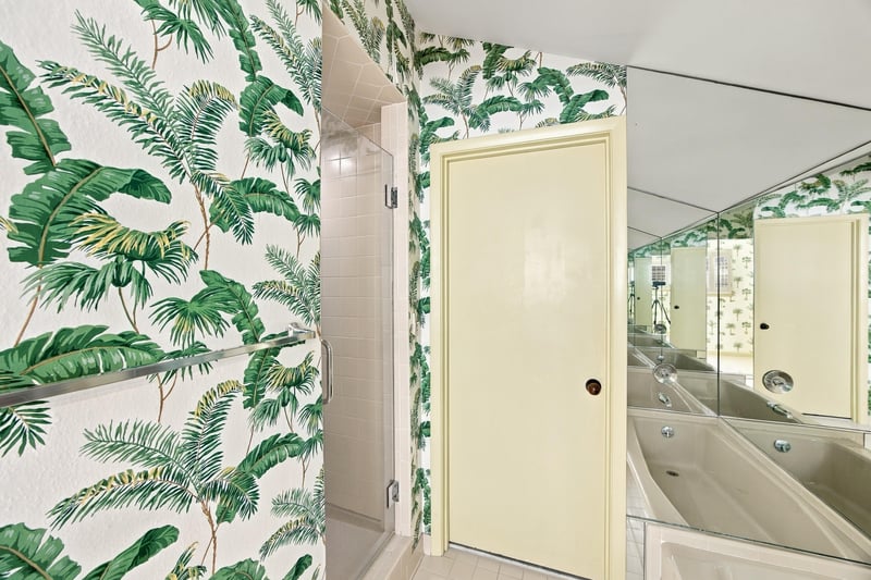 Bathroom corner with palm wallpaper and door at 752 Spinnakers Reach Dr, Ponte Vedra Beach, FL 32082