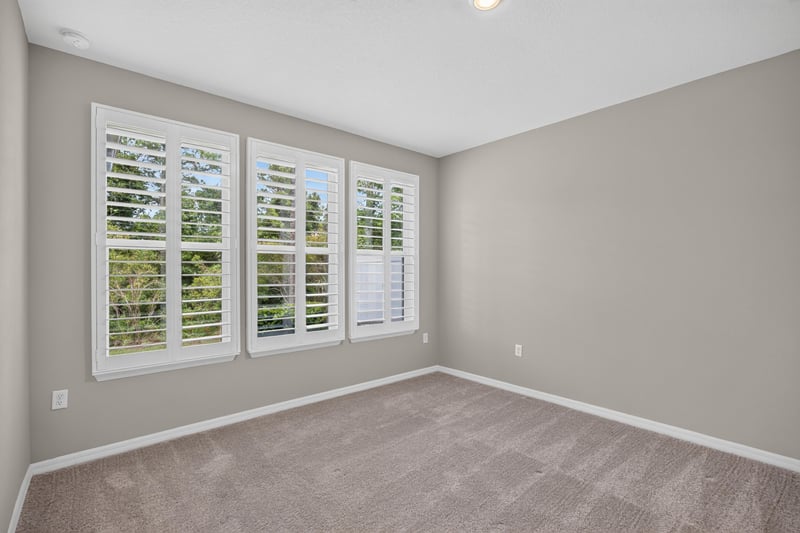Bedroom with carpet and plantation shutters at 171 Oyster Shell Ter, Nocatee, FL 32081