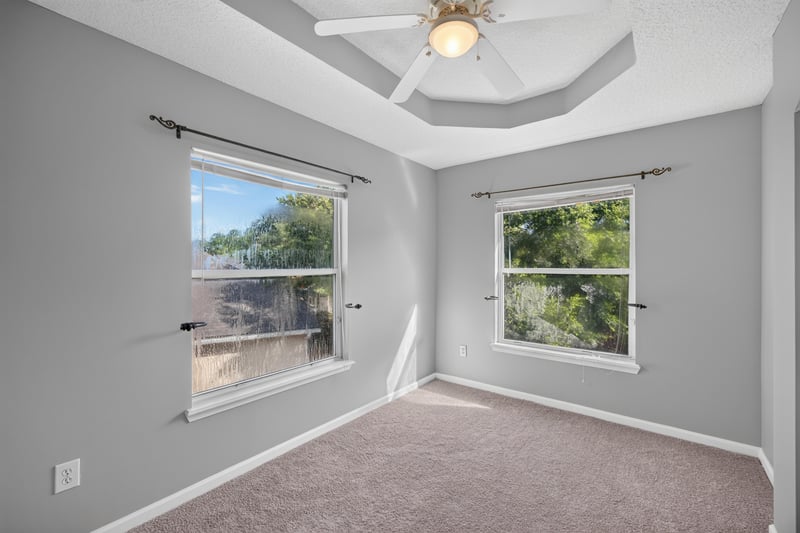 Bedroom staged with seating area at 470 Sparrow Branch Cir, Jacksonville, FL 32259