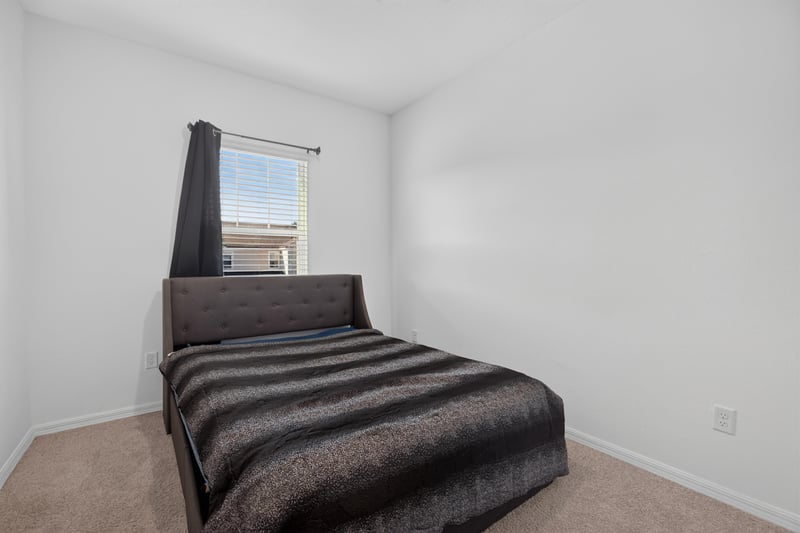 Bedroom with twin bed and window at 339 Anthony Dr, Jacksonville, FL