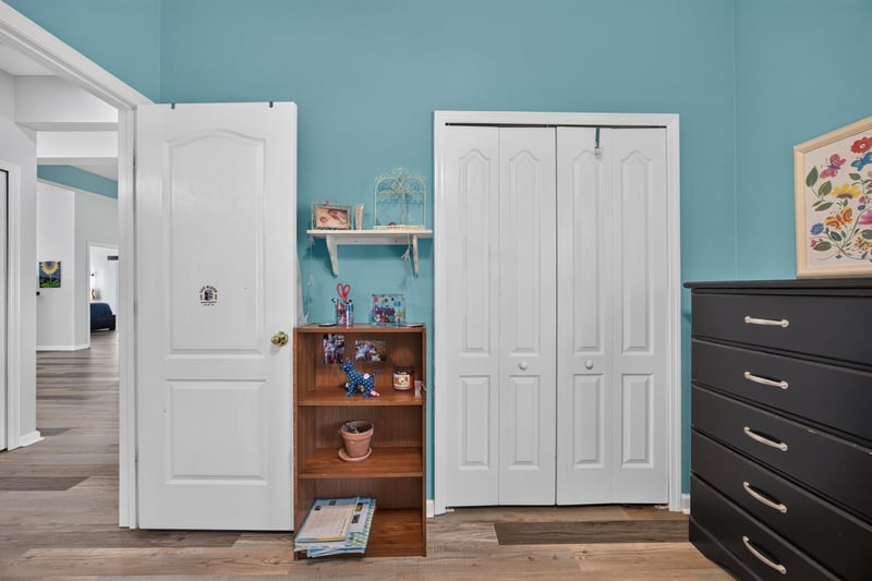 Bedroom with closet doors and dresser at 2065 Creekmont Dr