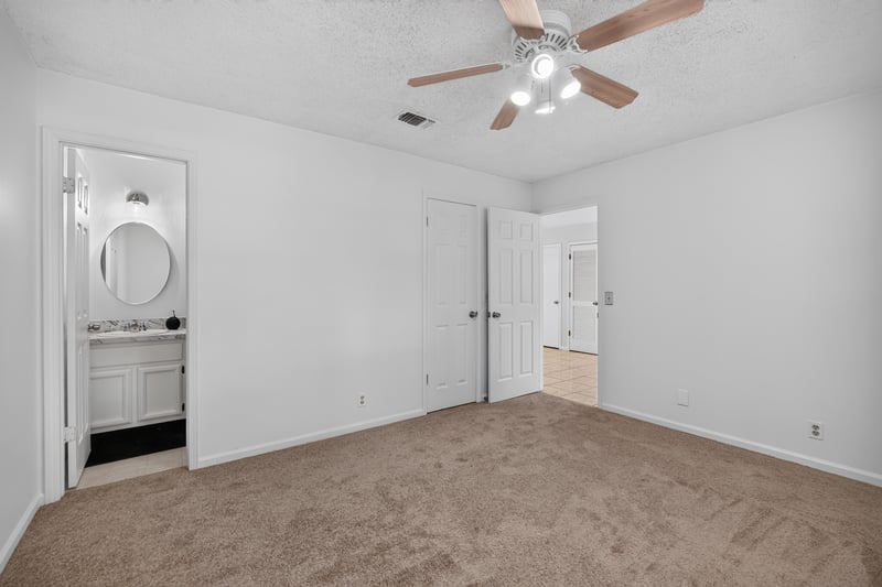 Hallway with bathroom door and closets at 2829 Blackberry Ave