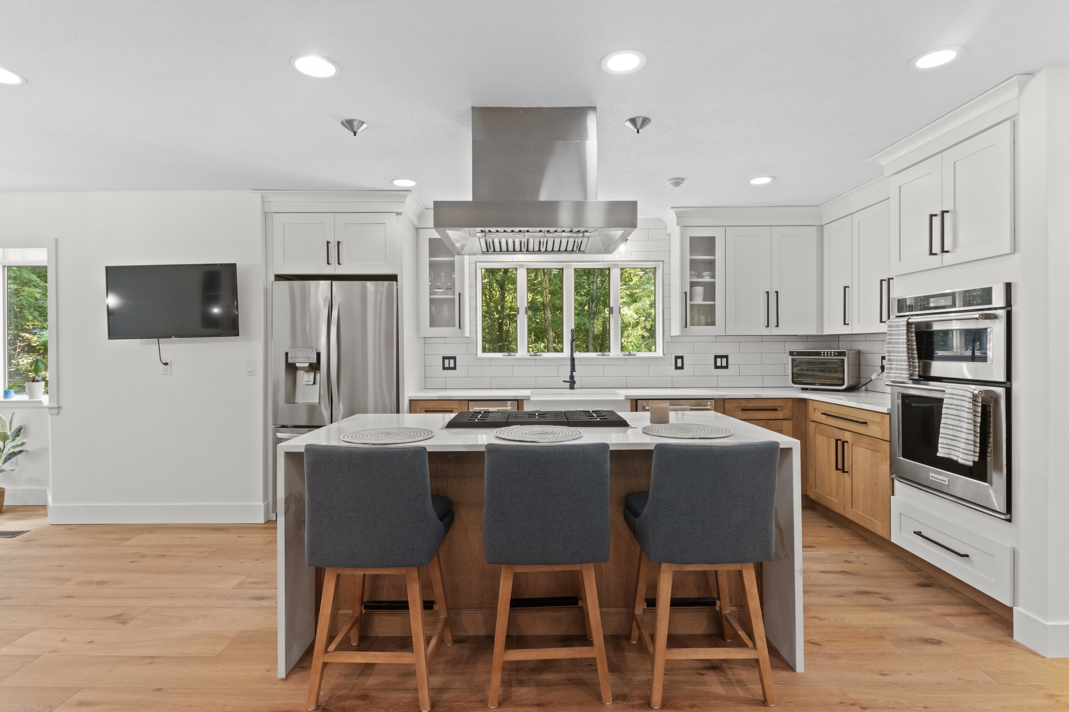 Bright contemporary kitchen with a generous island and warm wood cabinetry