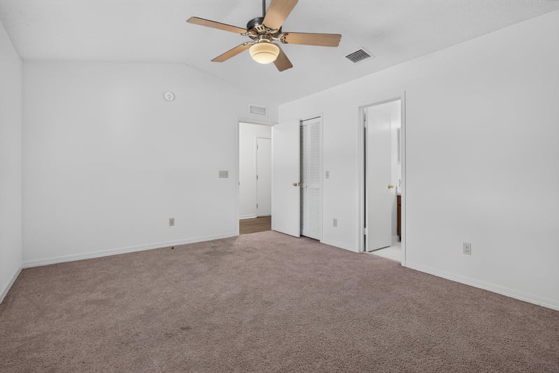 Bedroom hallway with closet doors at 1445 Classic Oak Rd W, Jacksonville, FL