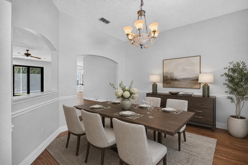 Dining room with chandelier and wood table at 11675 Magnolia Estates Rd, Jacksonville, FL 32223