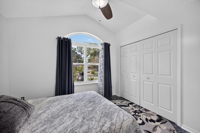 Bedroom with closet and arched window at 1346 Gately Ct, Jacksonville, FL 32225
