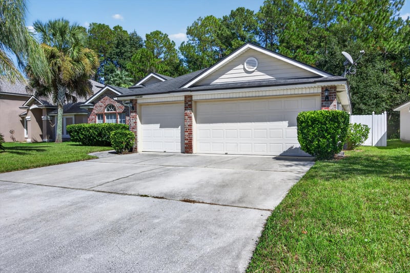 Front exterior, side angle of garage at 14147 Fish Eagle Dr E, Jacksonville, FL 32226