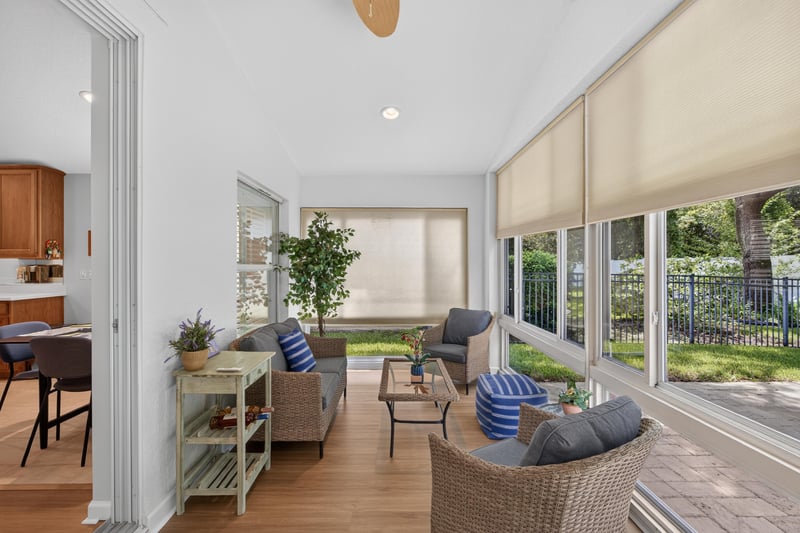 Sunroom with seating area and windows at 11225 Water Spring Cir, Jacksonville, FL 32256