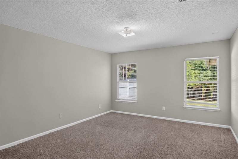 Carpeted bedroom with window at 14147 Fish Eagle Dr E, Jacksonville, FL 32226
