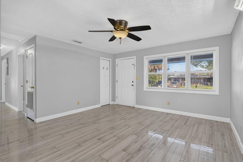 Living room with wood-look flooring and ceiling fan at 442 Ameca Ave, Orange Park, FL 32073