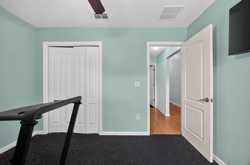 Hallway with closet doors at 3112 Silverado Cir, Green Cove Springs, FL 32043