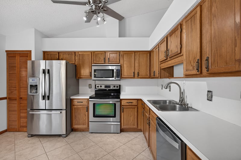 Kitchen view with tile floor and stainless refrigerator at 2460 San Sago Ln, Jacksonville, FL
