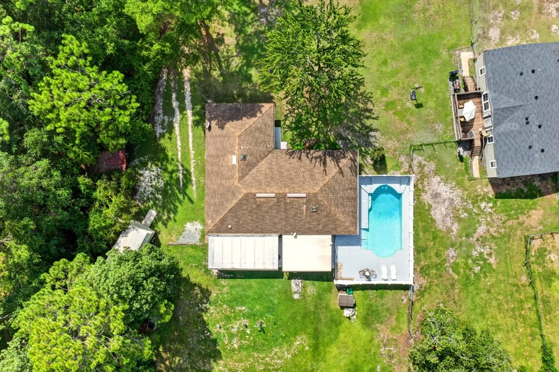 Aerial view of the roofline and pool area at 2435 Range Line Rd, Middleburg, FL