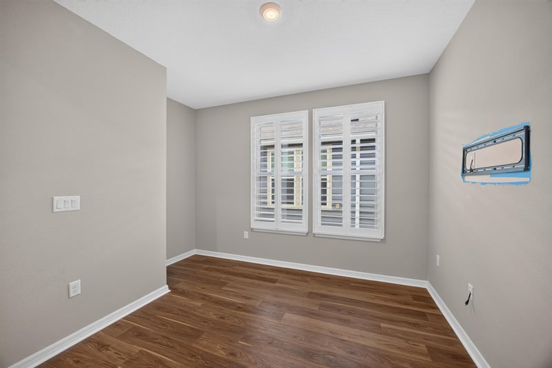 Flex room with plantation shutters and wood floor at 171 Oyster Shell Ter, Nocatee, FL 32081